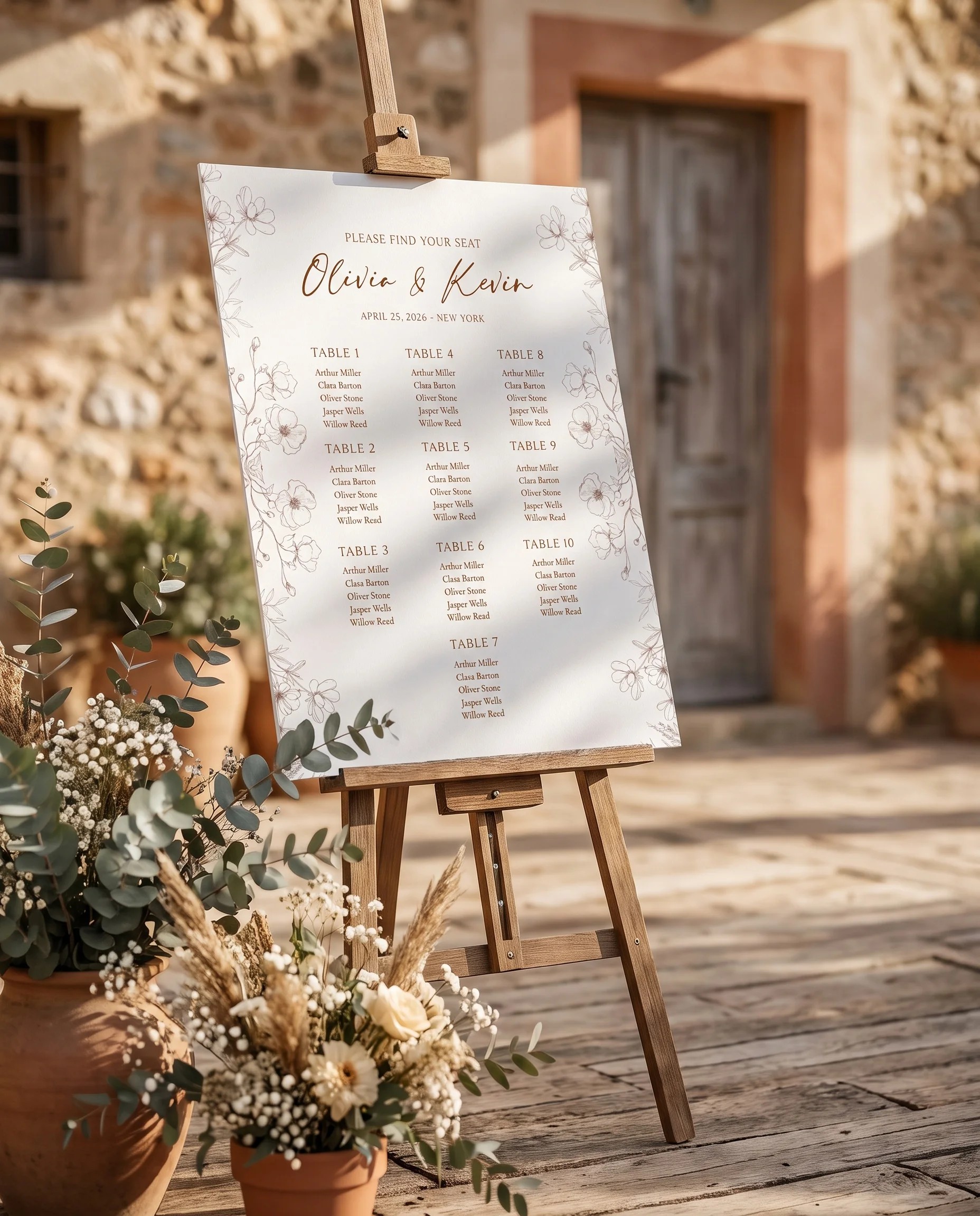 Arrow Bloom wedding seating chart — displayed near a reception entrance under soft natural light, seating chart template