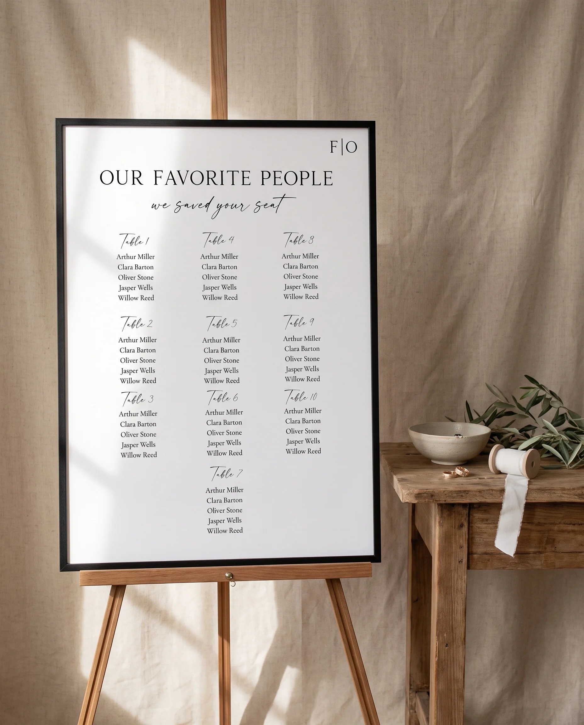 Lumen Frame wedding seating chart — shown beside furniture for scale under soft natural light, wedding seating chart template.