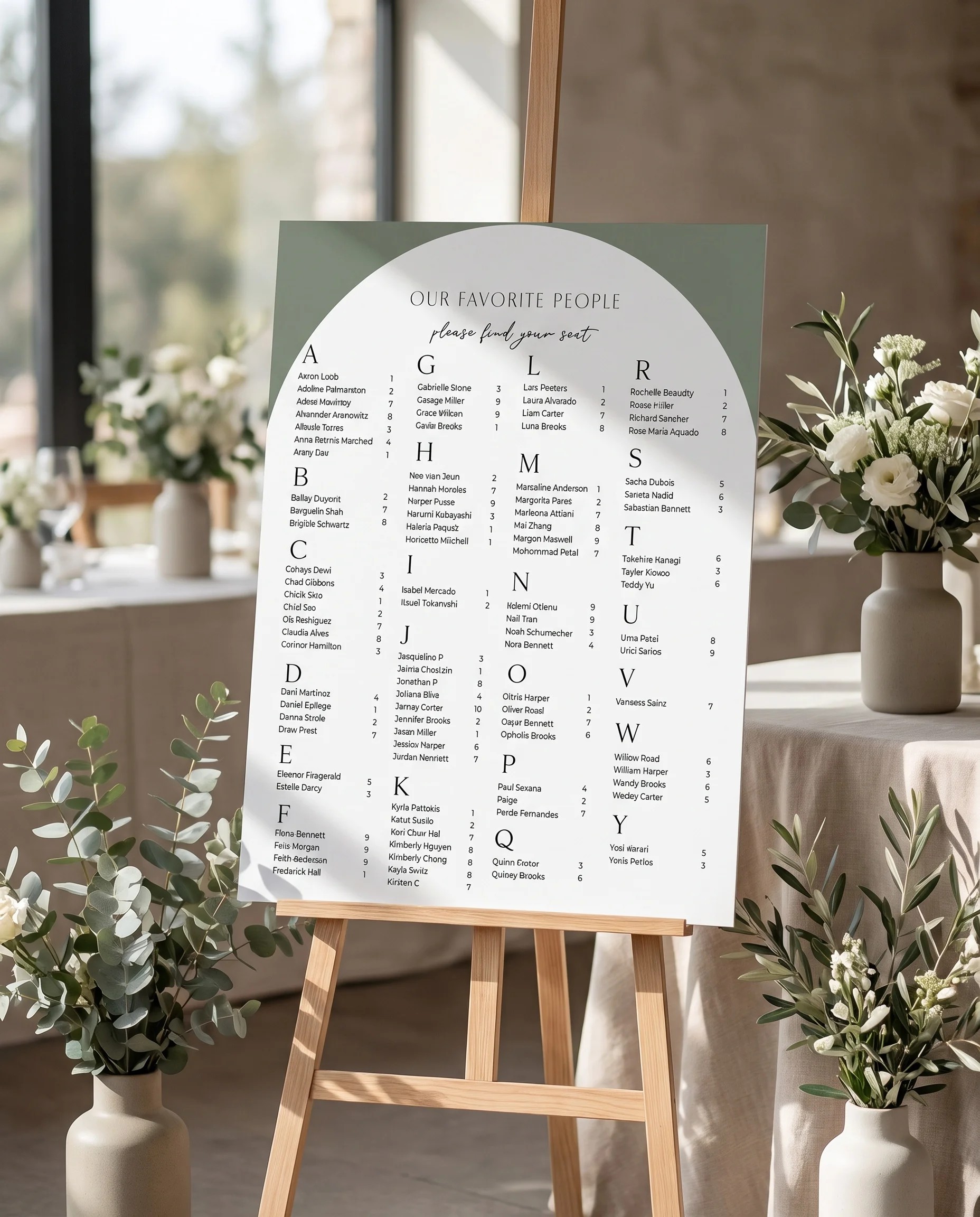 Arc Vale wedding seating chart — single page displayed at a reception entrance under soft natural light, seating chart template