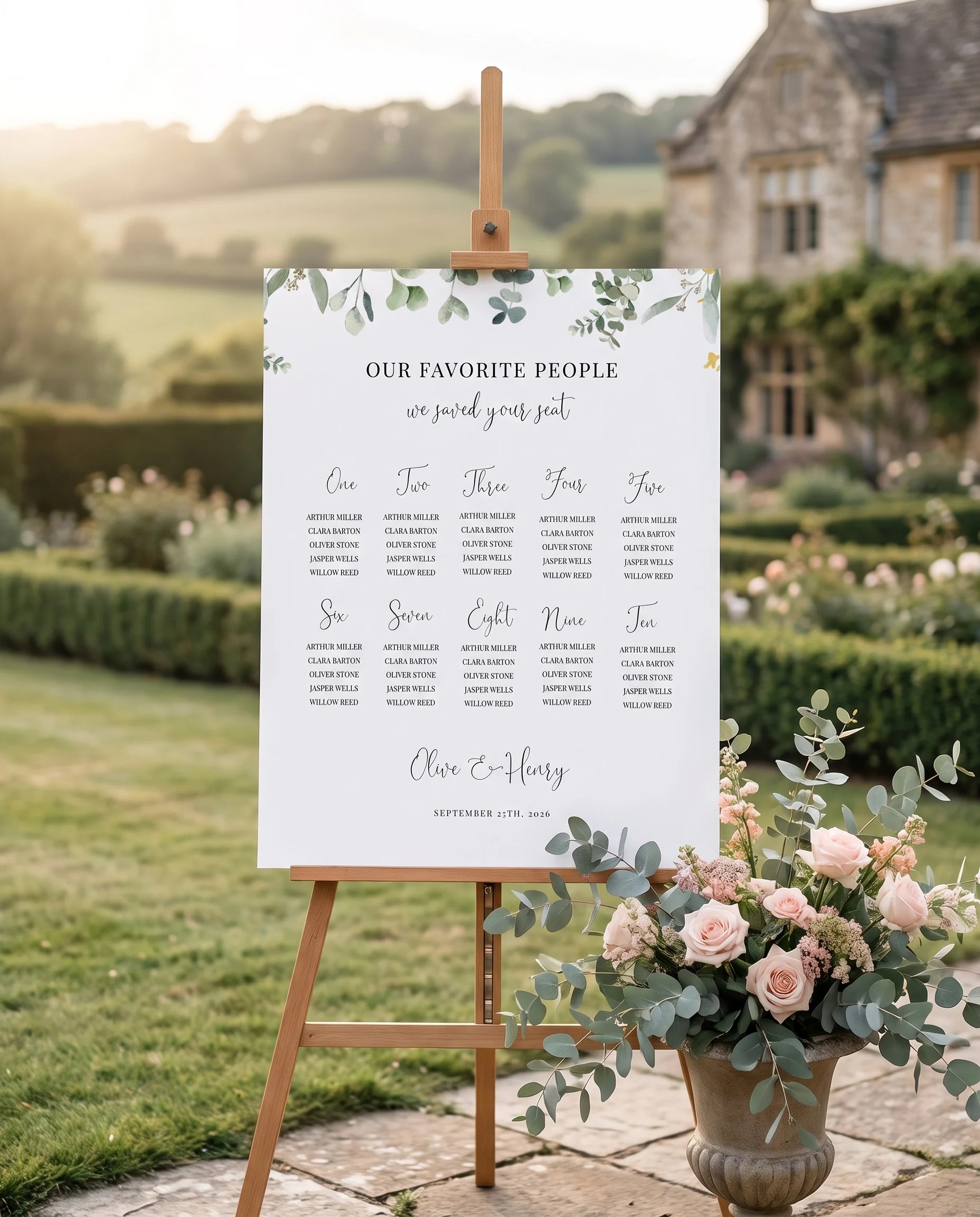 Eucalyptus Gold wedding seating chart — single page displayed at a reception entrance under soft natural light, seating chart template