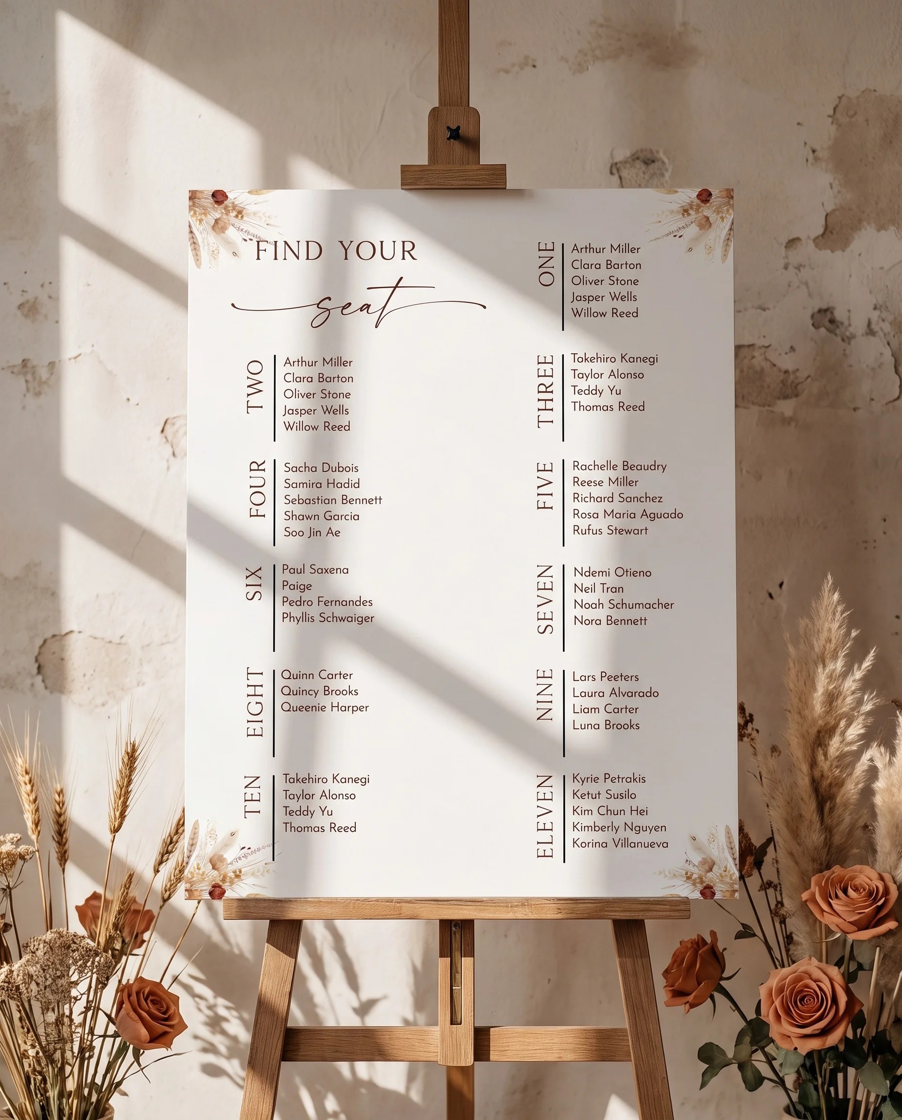 Harvest Script wedding seating chart — single page displayed on an easel under soft natural light, wedding seating chart