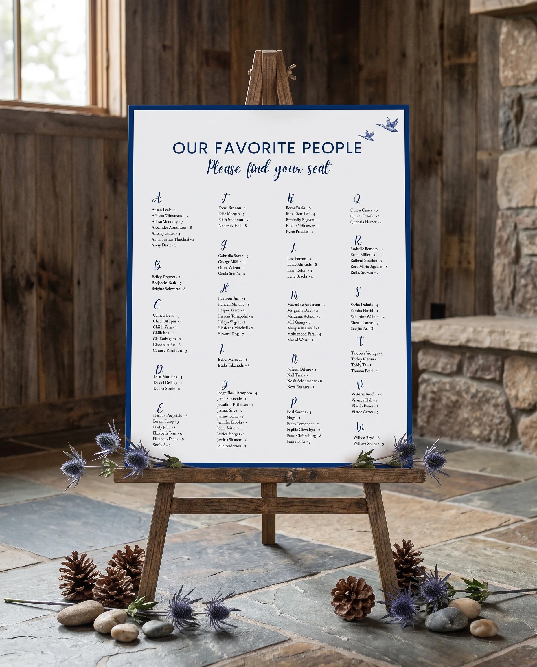 Blue Range wedding seating chart — displayed on an easel under soft natural light with a slight overhead angle, wedding seating chart