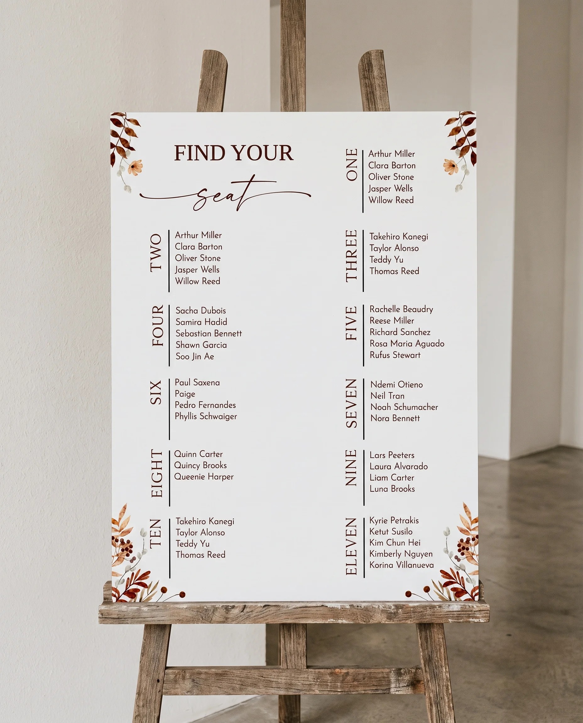 Autumn Bower wedding seating chart — displayed on an easel under soft natural light with a slight overhead angle, wedding seating chart.