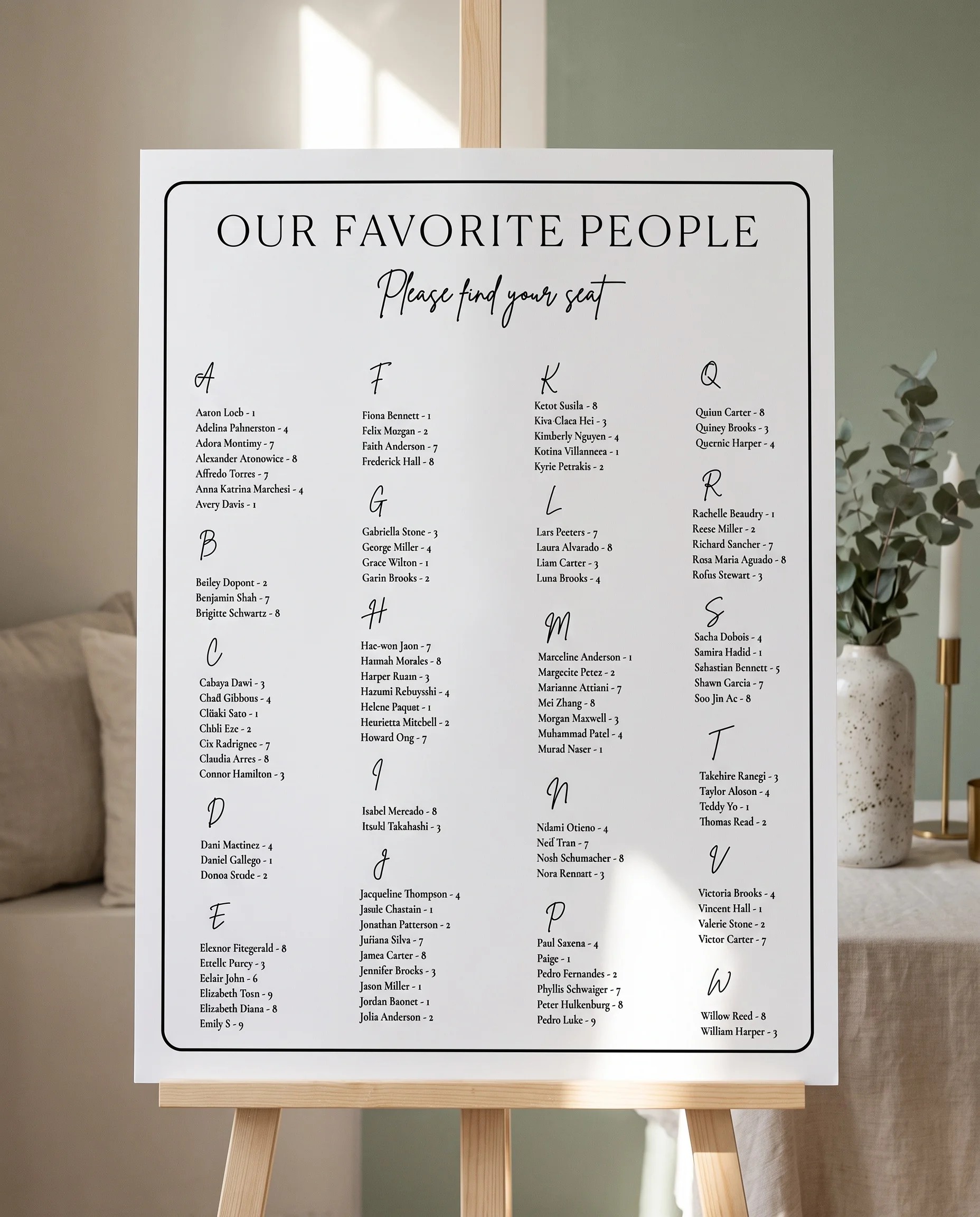 Contour wedding seating chart — displayed on an easel under soft natural light with a slight overhead angle, wedding seating chart