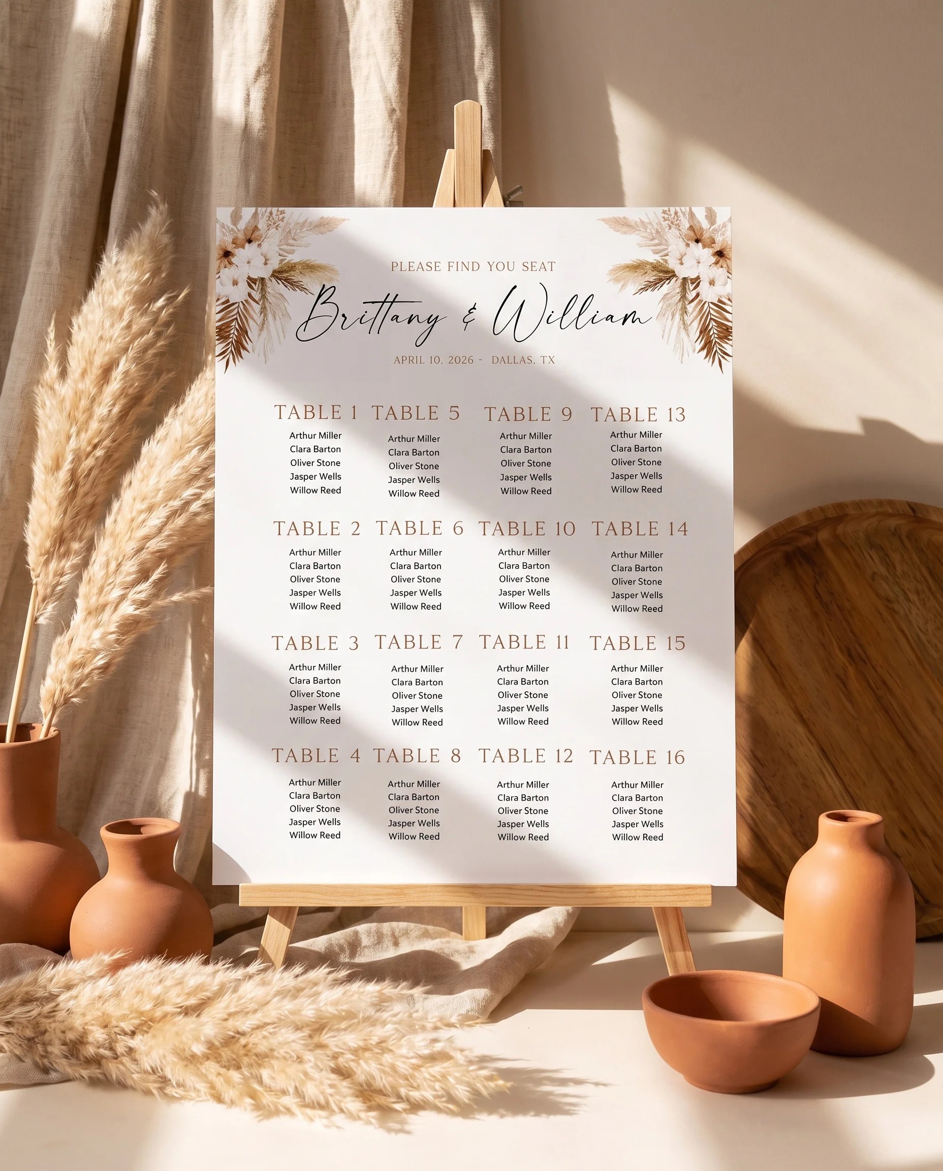 Pampas Bloom wedding seating chart — displayed on an easel under soft natural light with a slight overhead angle, wedding seating chart