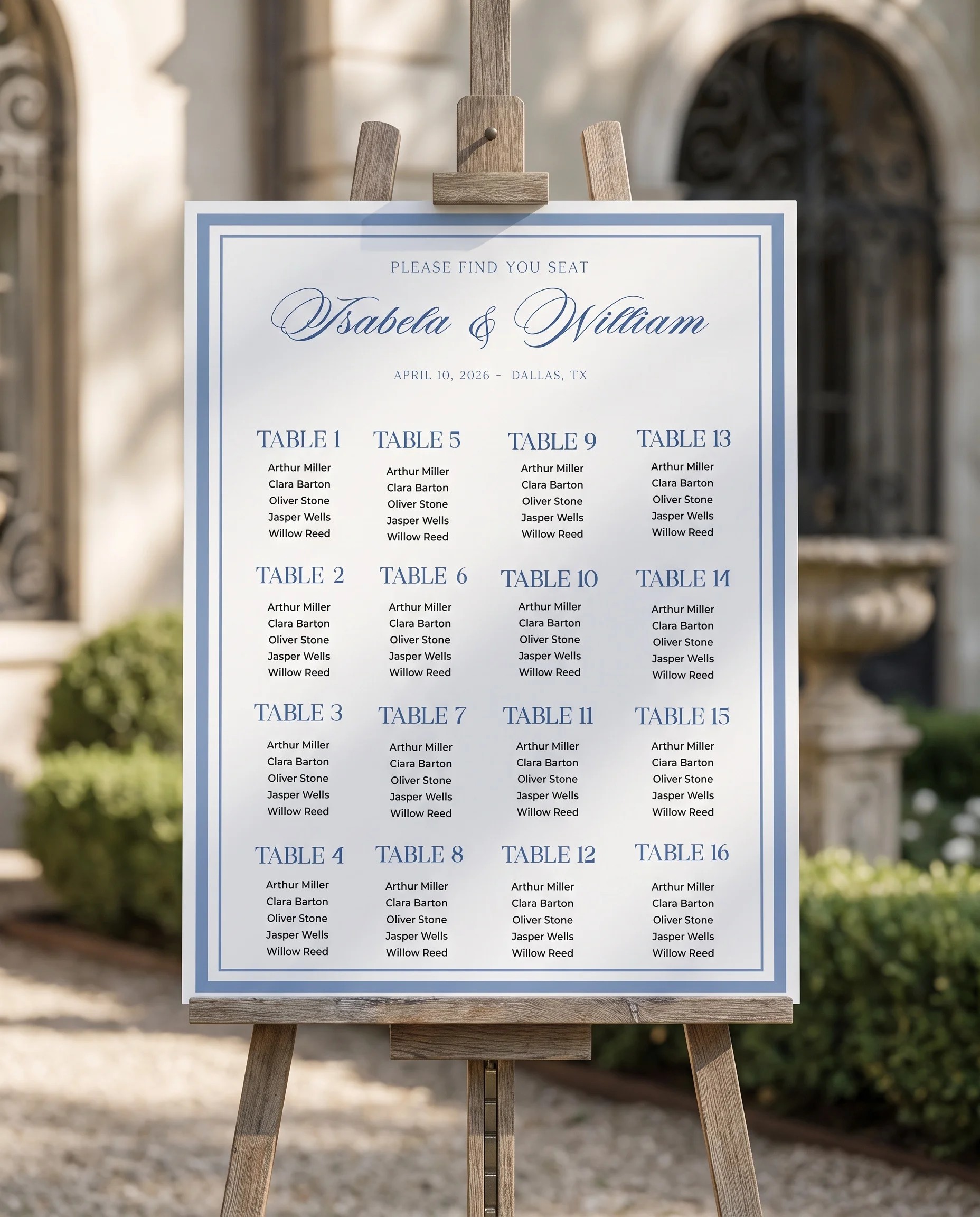 Azure Flourish wedding seating chart — displayed on an easel under soft natural light with a slight overhead angle, wedding seating chart