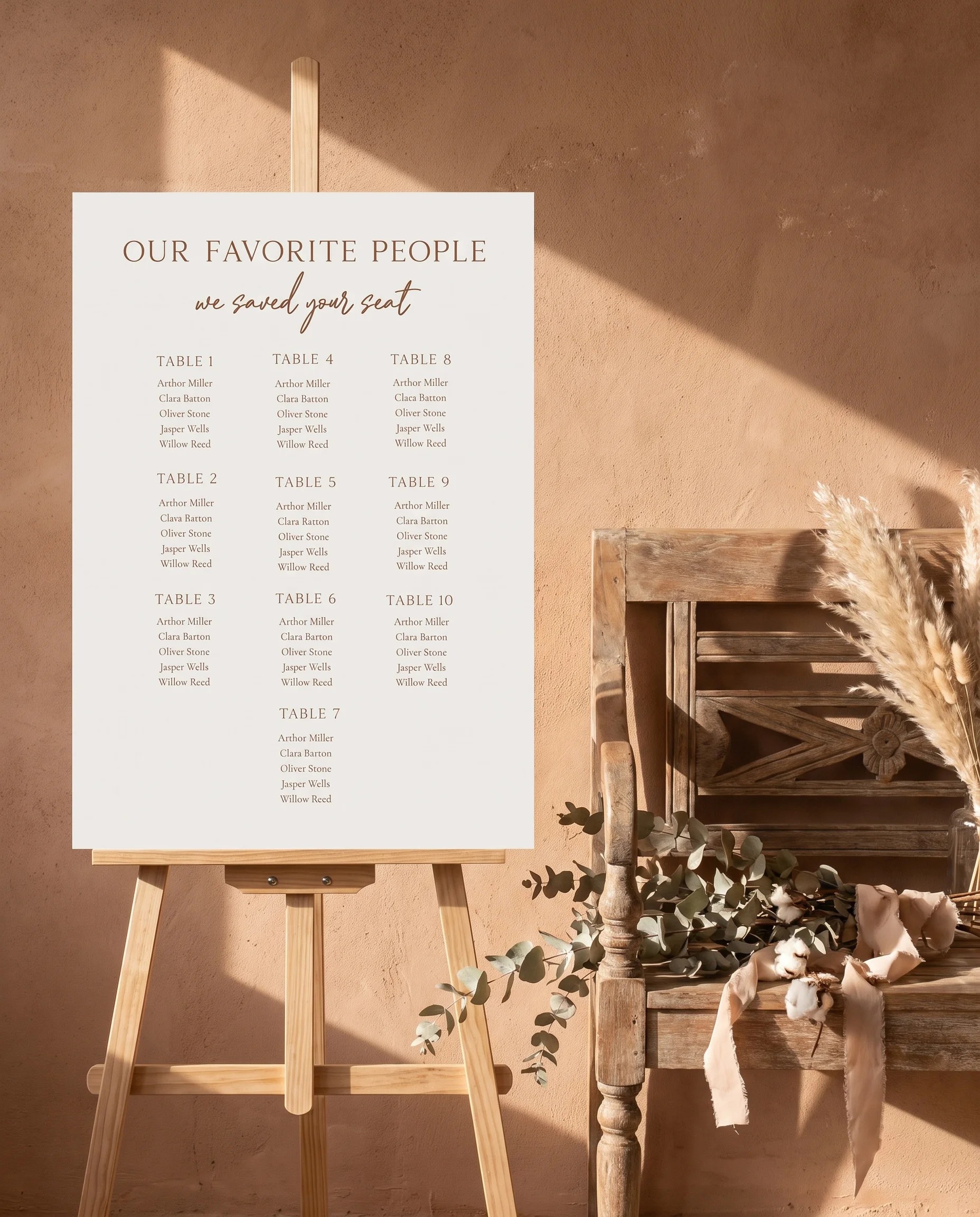 Briar Script wedding seating chart — shown beside furniture for scale under soft natural light on premium editorial paper, wedding seating chart template