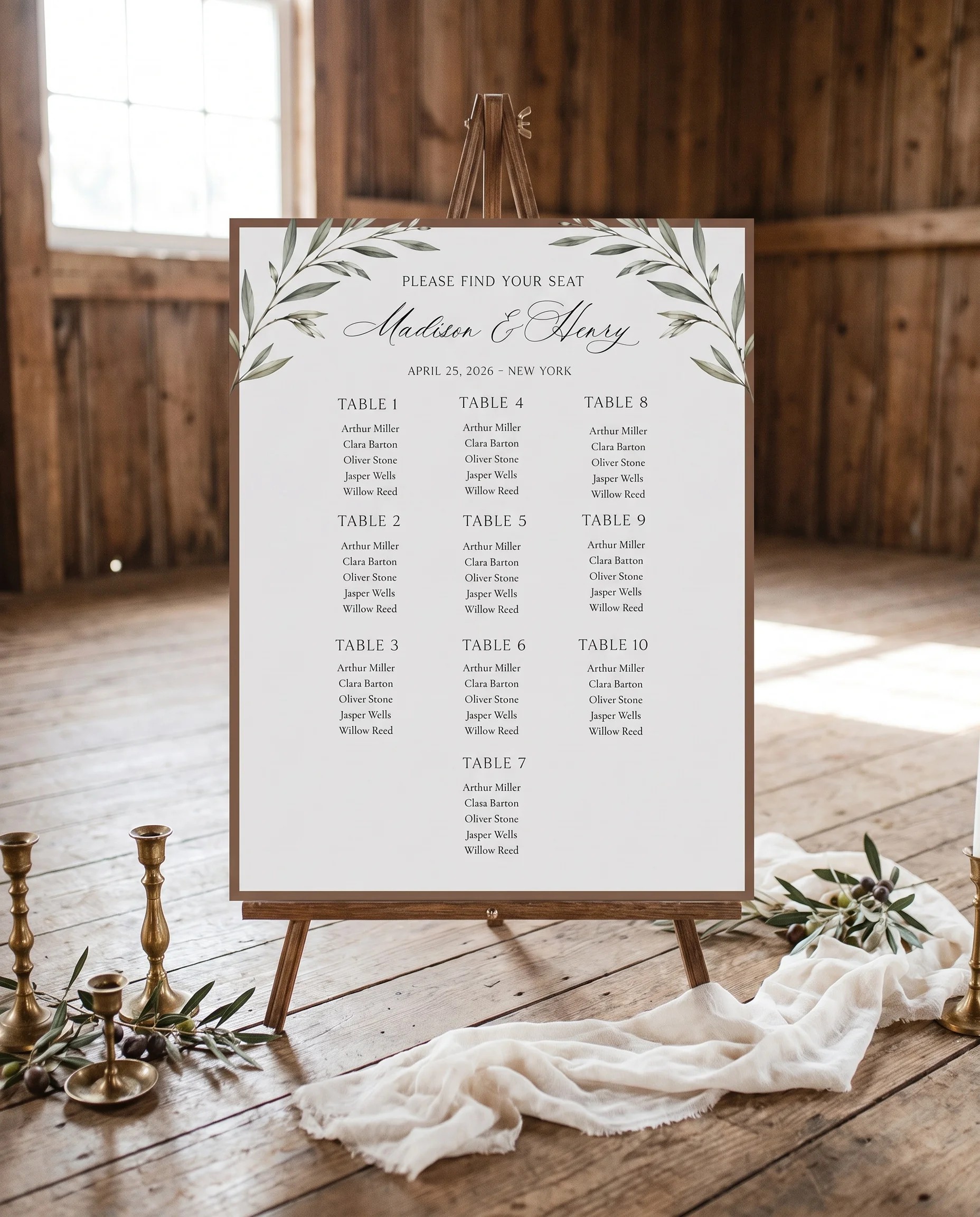 Olive Arc wedding seating chart — displayed on an easel under soft natural light at a slight overhead angle, wedding seating chart.