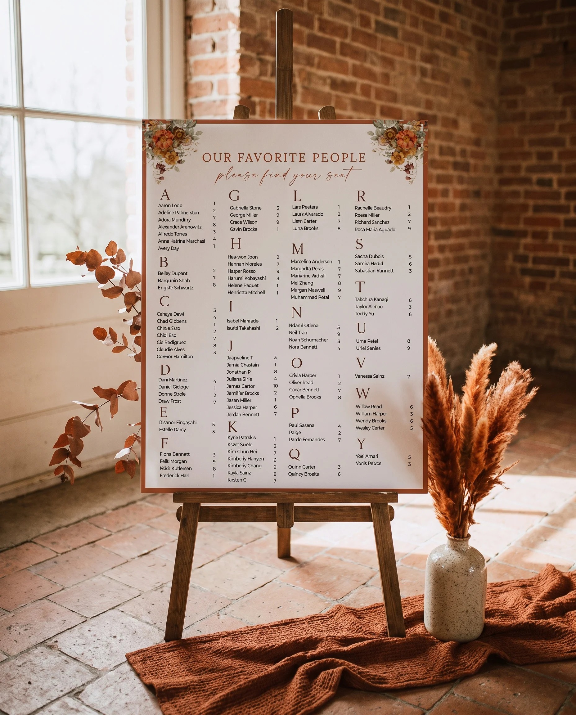 Terracotta Crown wedding seating chart — displayed on an easel under soft natural light with a slight overhead angle, wedding seating chart.