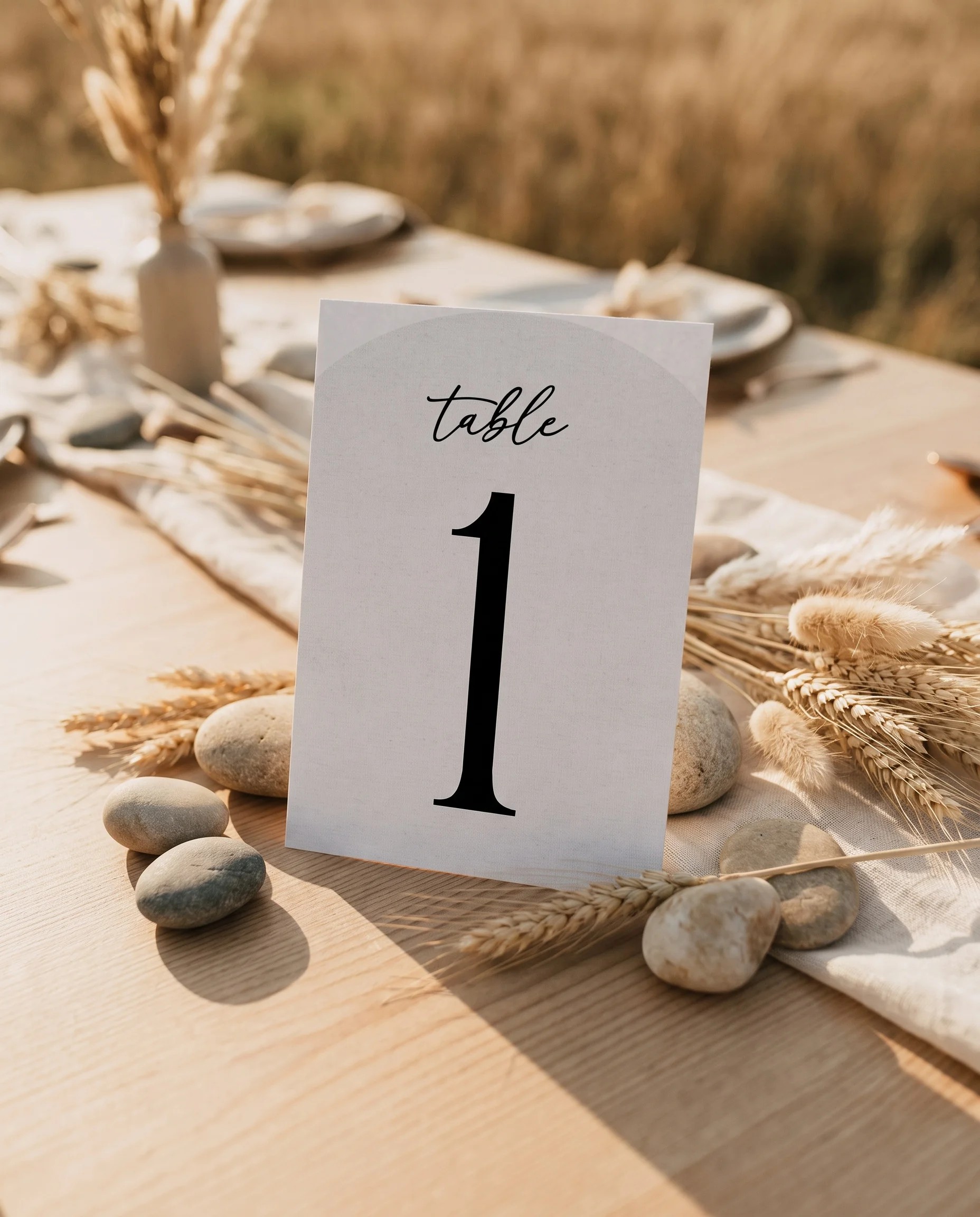 Halo Arch wedding table number — standing upright on a dressed table under soft overhead light, table numbers wedding