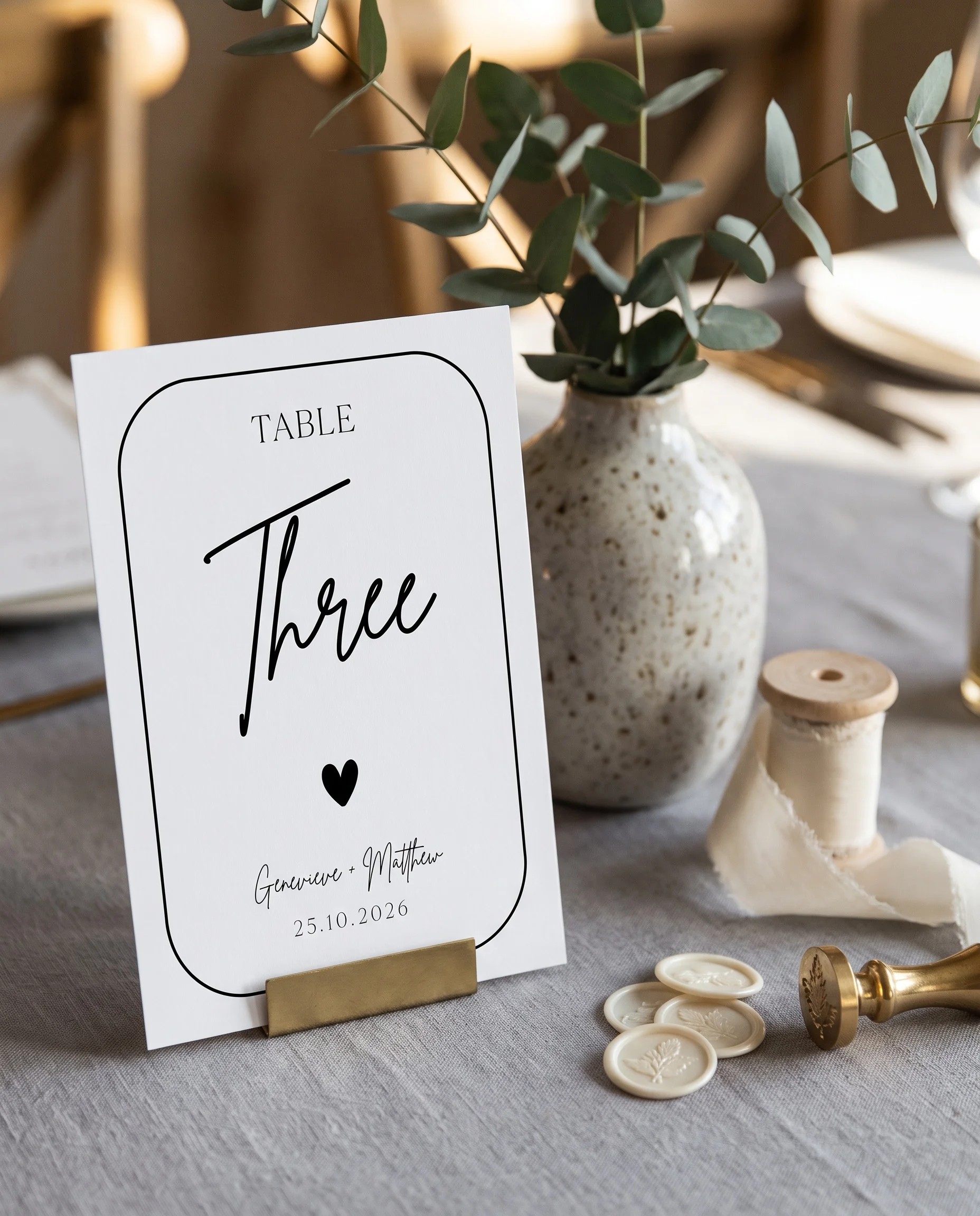 Contour wedding table number — standing upright on a dressed table under soft natural light, table numbers wedding