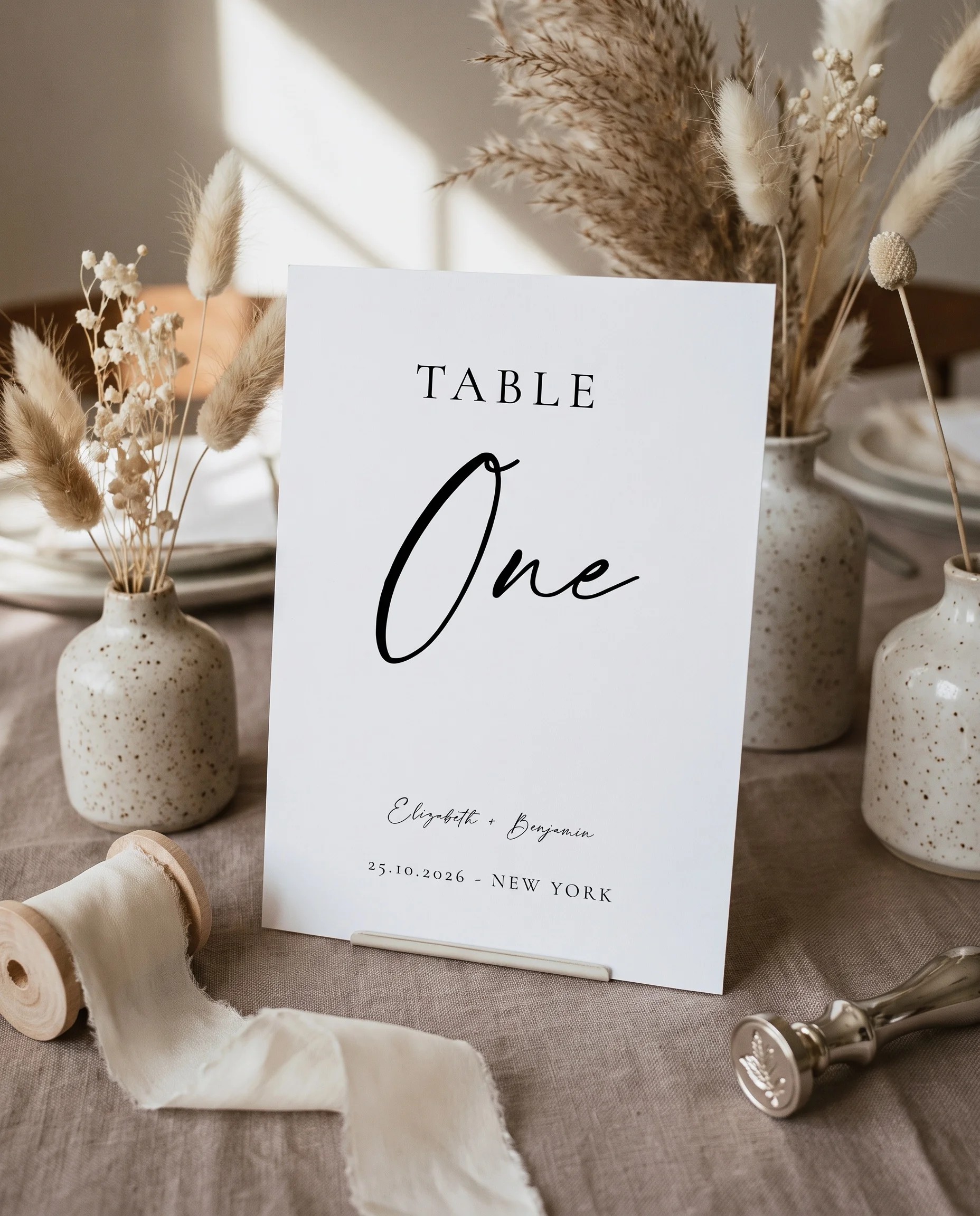 Tonal Reply wedding table number — standing upright on a dressed table under soft natural light, table numbers wedding