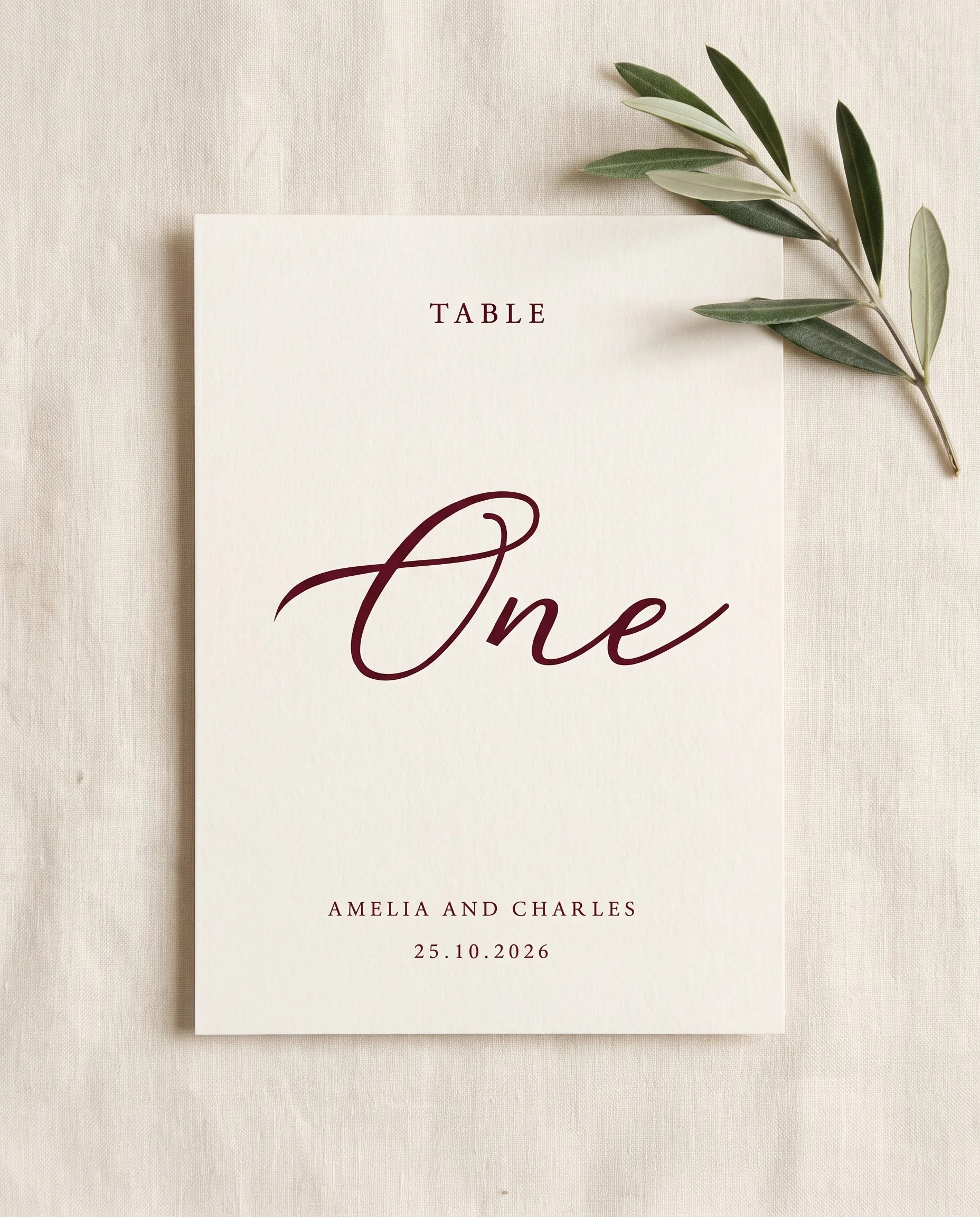Claret Vine wedding table number — single card shown flat under soft overhead light on premium paper, wedding table numbers.