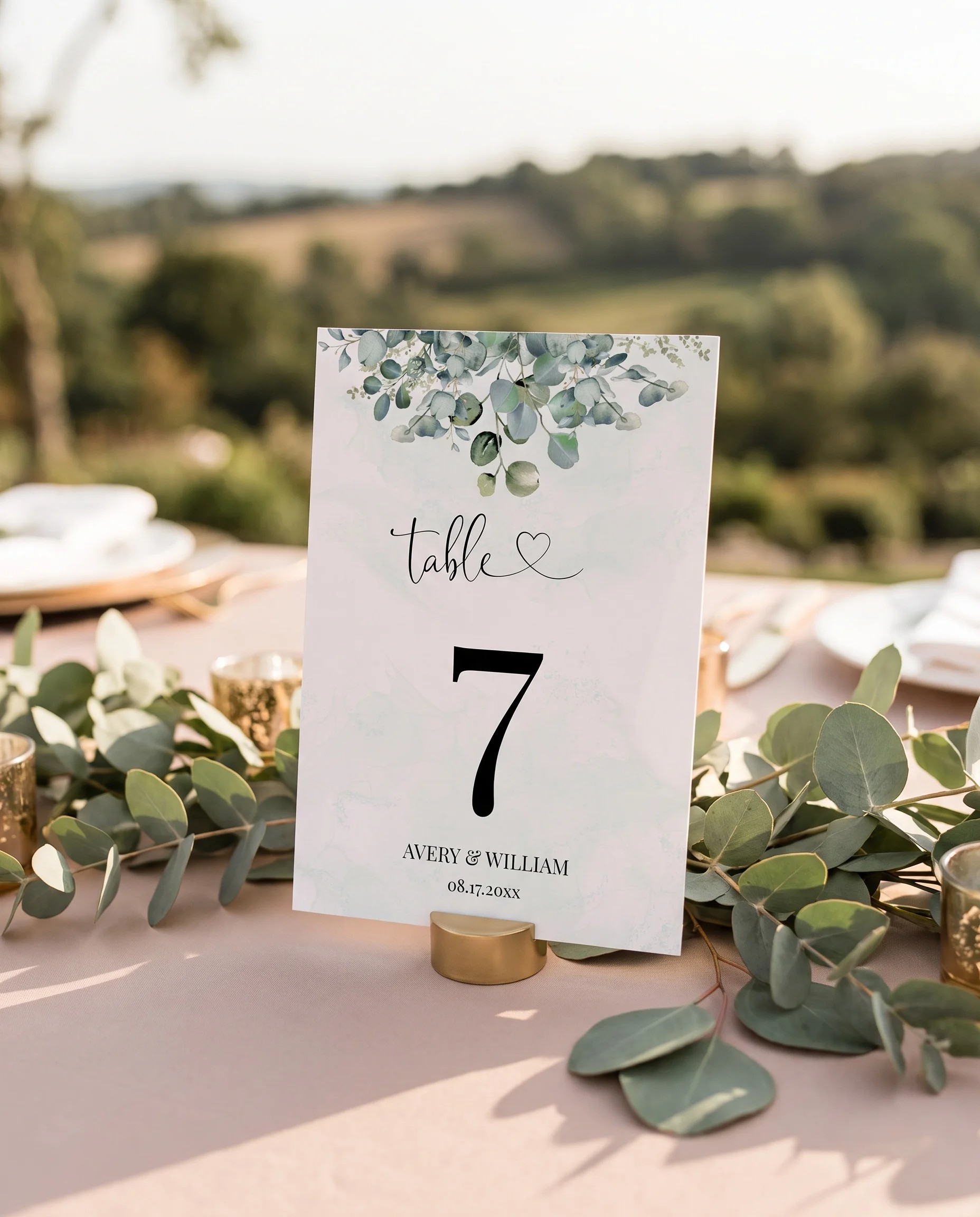 Eucalyptus Gold wedding table number — standing upright on a dressed table under soft natural light, table numbers wedding.