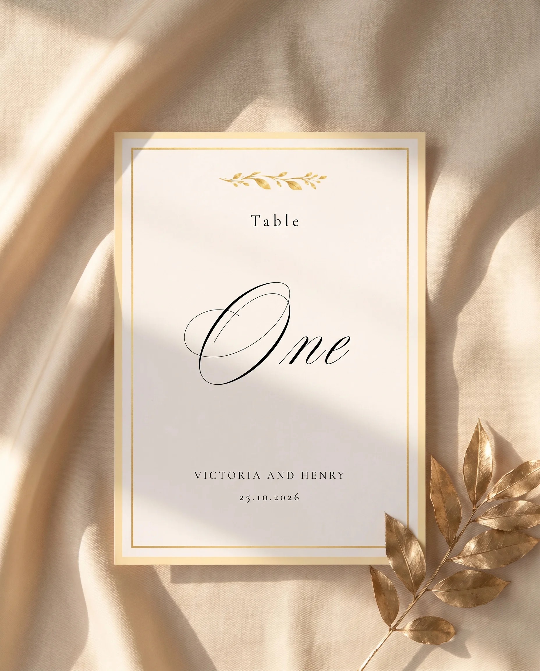 Gilded Bough wedding table number — shown flat on premium editorial paper under soft natural light, slight overhead angle, wedding table numbers
