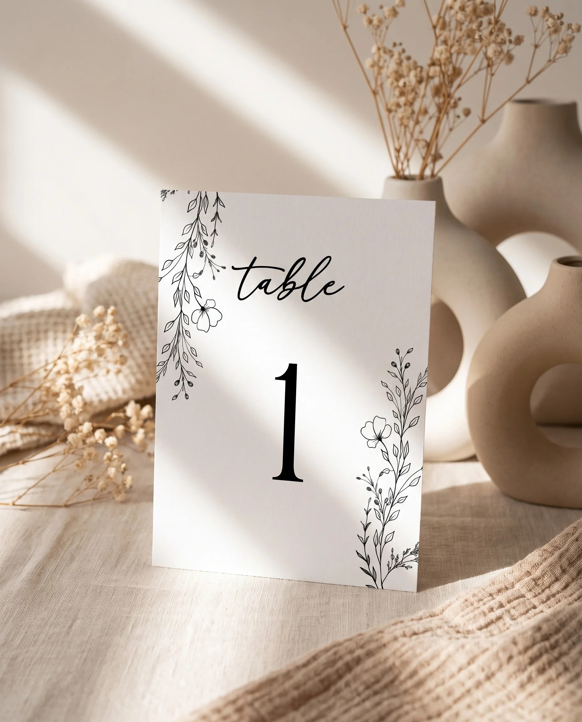 Meadow Sprig wedding table number — standing upright on a dressed table under soft natural light, table numbers wedding.