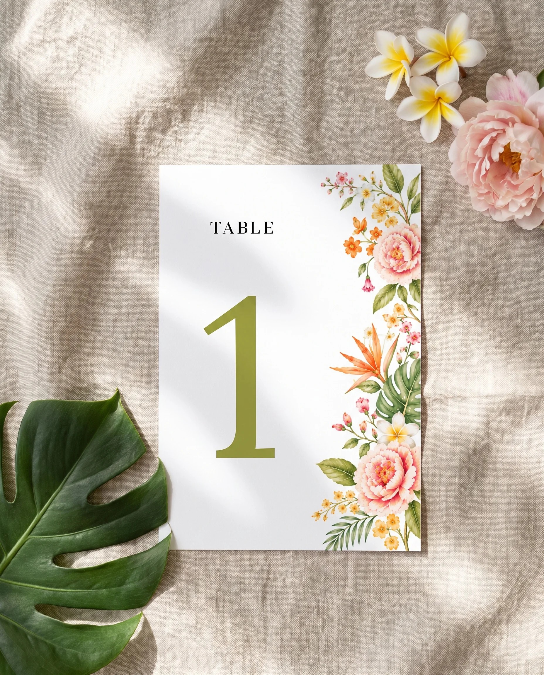 Plumeria Peony wedding table number — single page lying flat under soft overhead light on premium editorial paper, wedding table numbers.