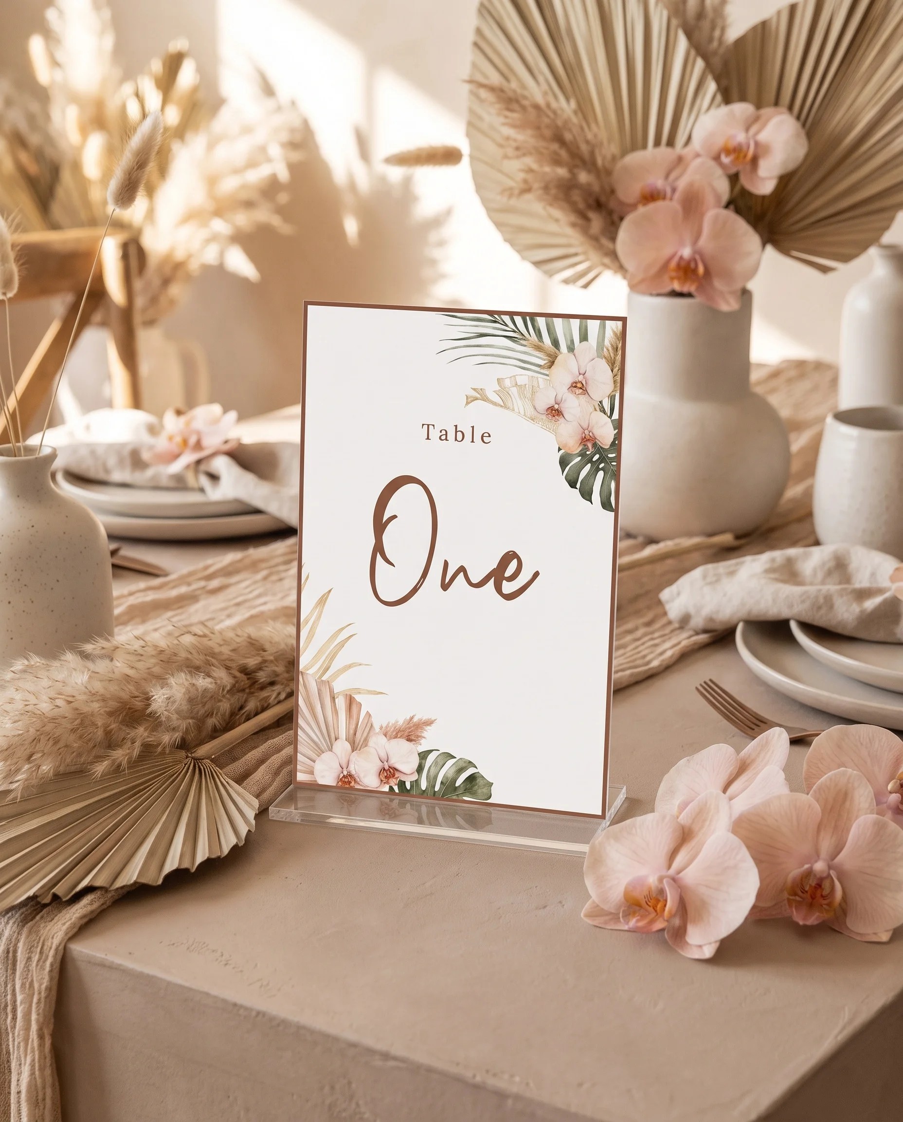 Palm Orchid wedding table number — standing upright on a dressed table under soft natural light, table numbers wedding
