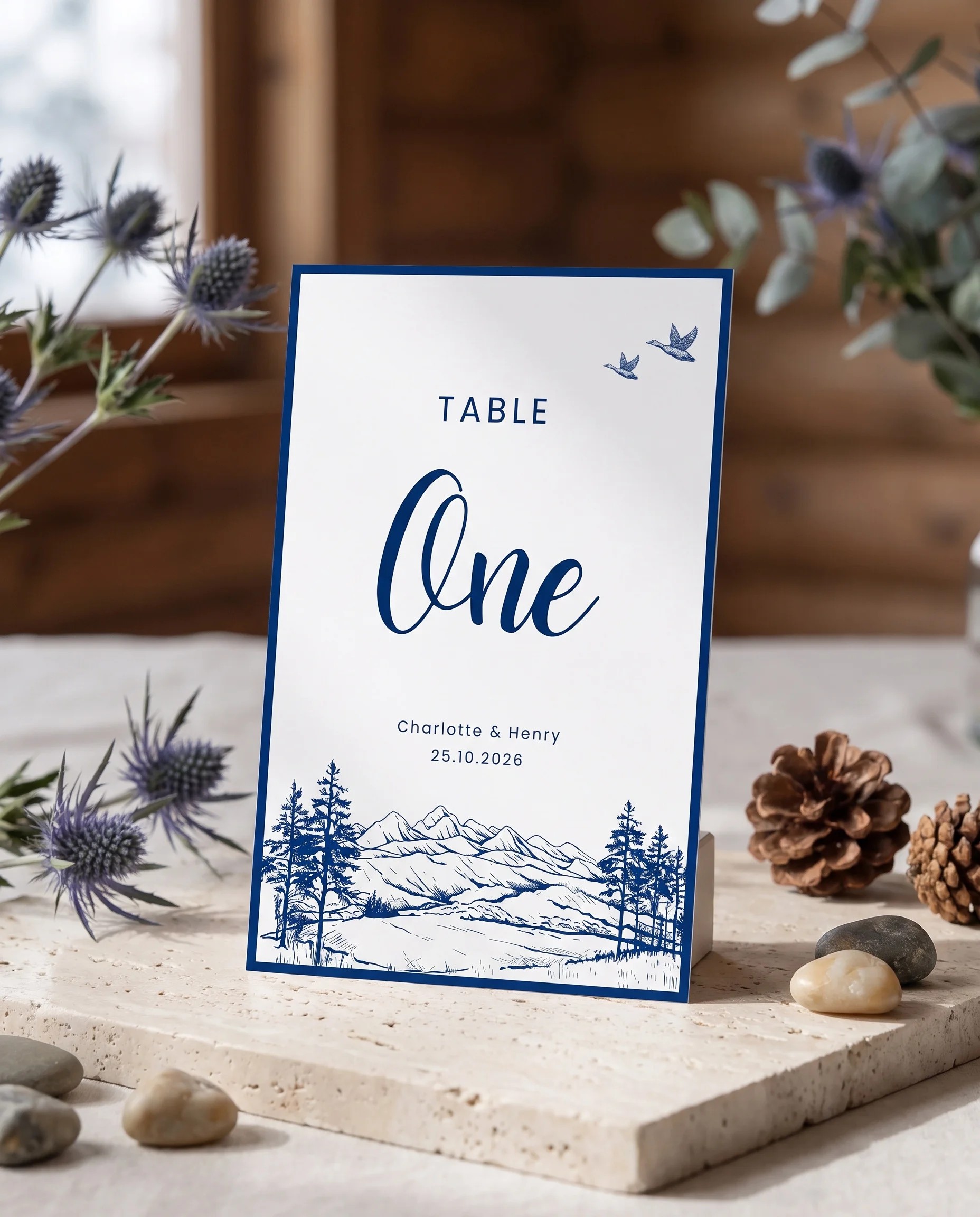 Blue wedding table number — standing upright on a dressed table under soft natural light, table numbers wedding.