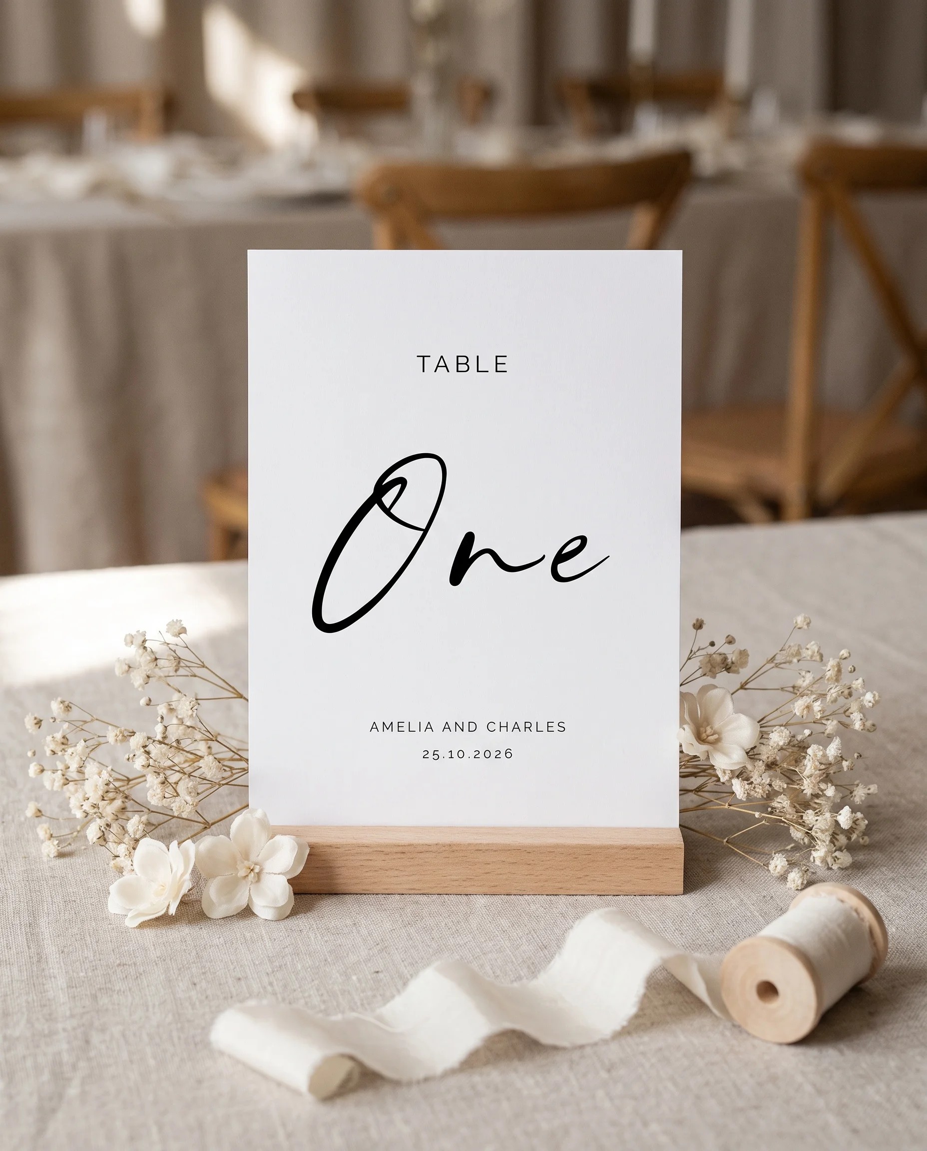Cathedral wedding table number — standing upright on a dressed table under soft natural light, table numbers wedding.