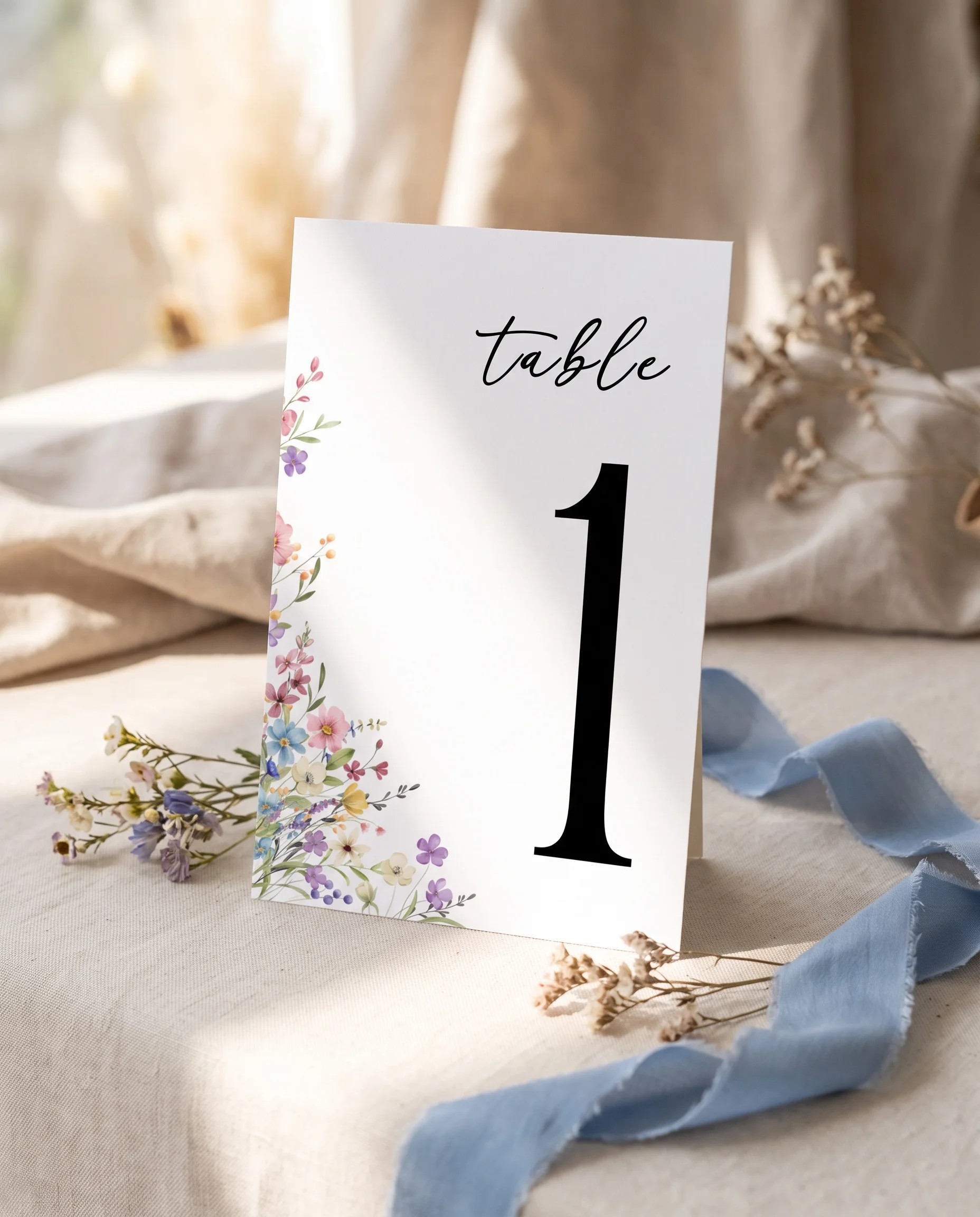 Meadowlark wedding table number — standing upright on a dressed table under soft natural light, table numbers wedding.