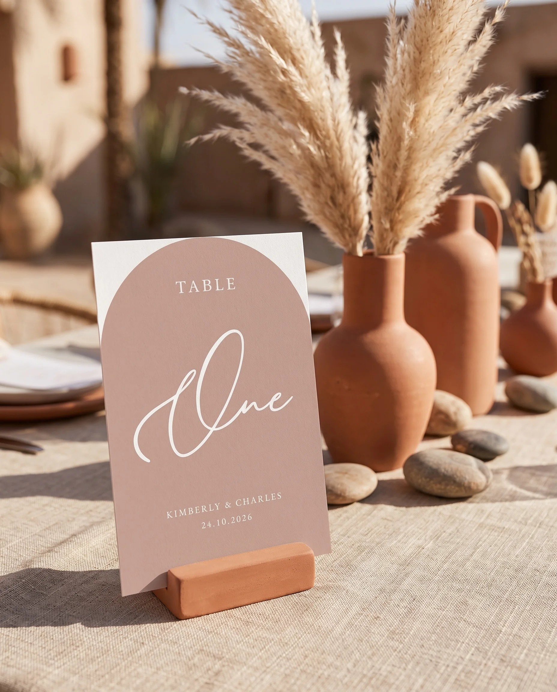 Desert Bloom wedding table number — standing upright on a dressed table under soft natural light, table numbers wedding