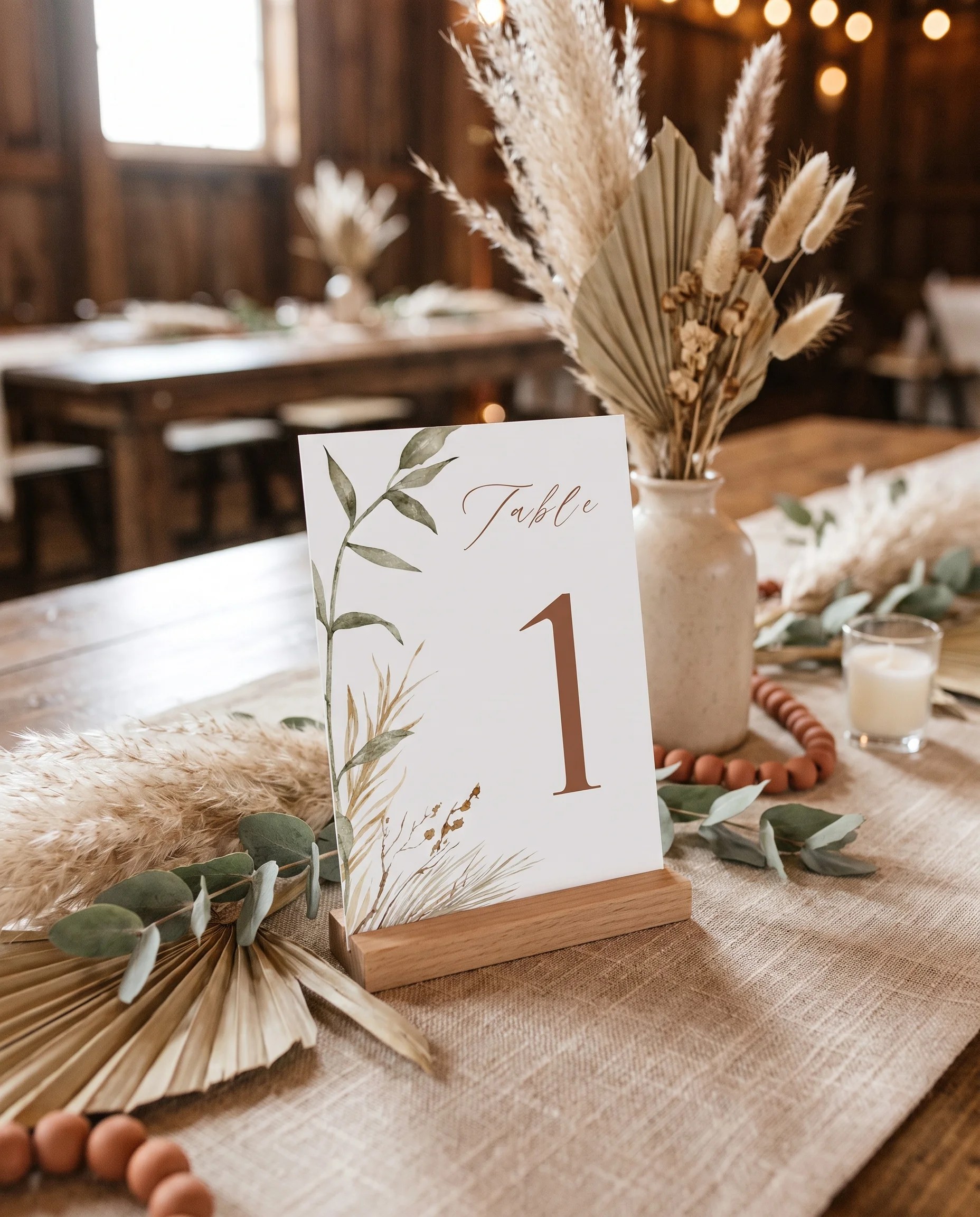 Prairie Fern wedding table number — the card standing upright on a dressed table in soft natural light, table numbers wedding.