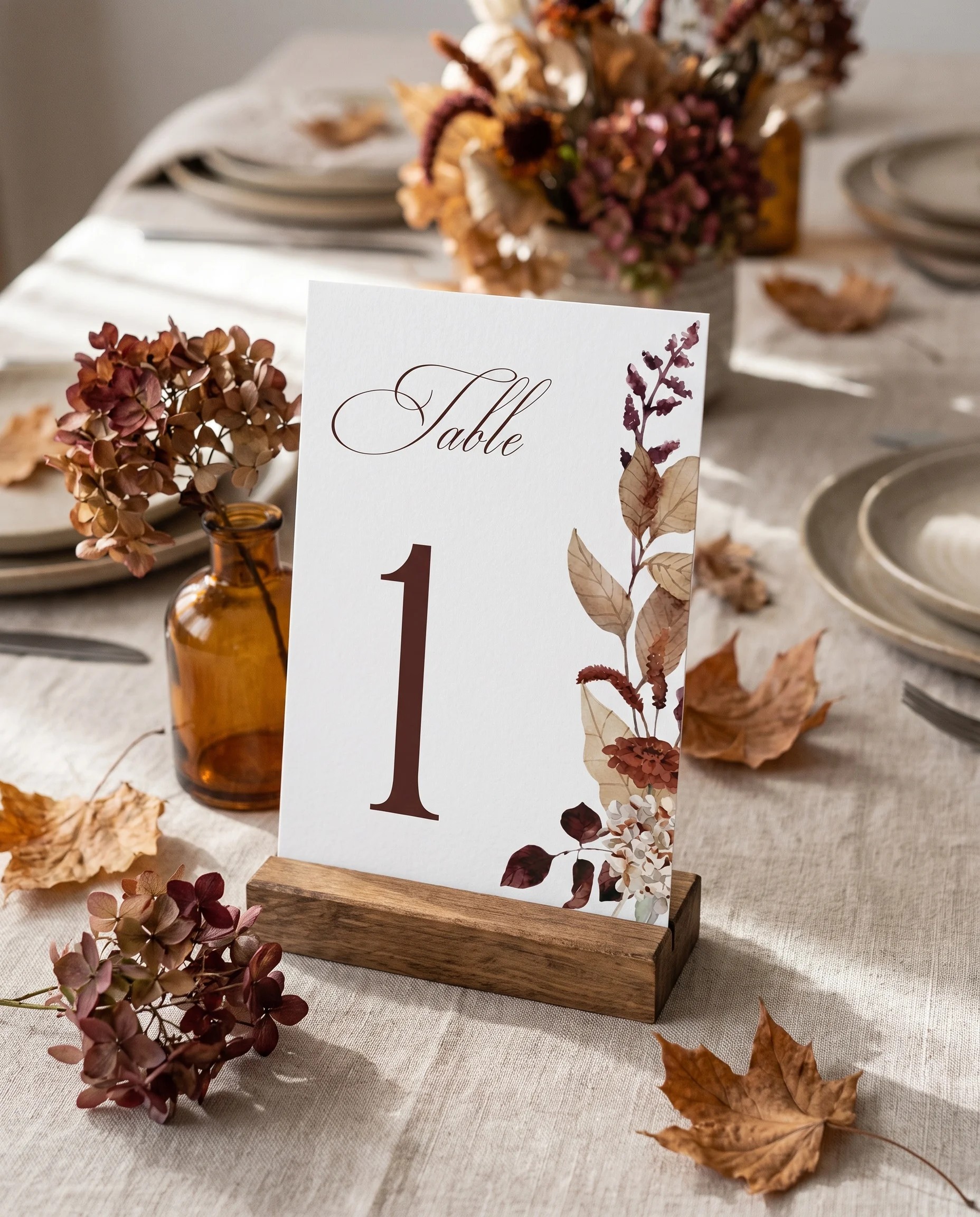 Bramble Row wedding table number — standing upright on a dressed table under soft natural light, shot from a slight overhead angle, table numbers wedding.