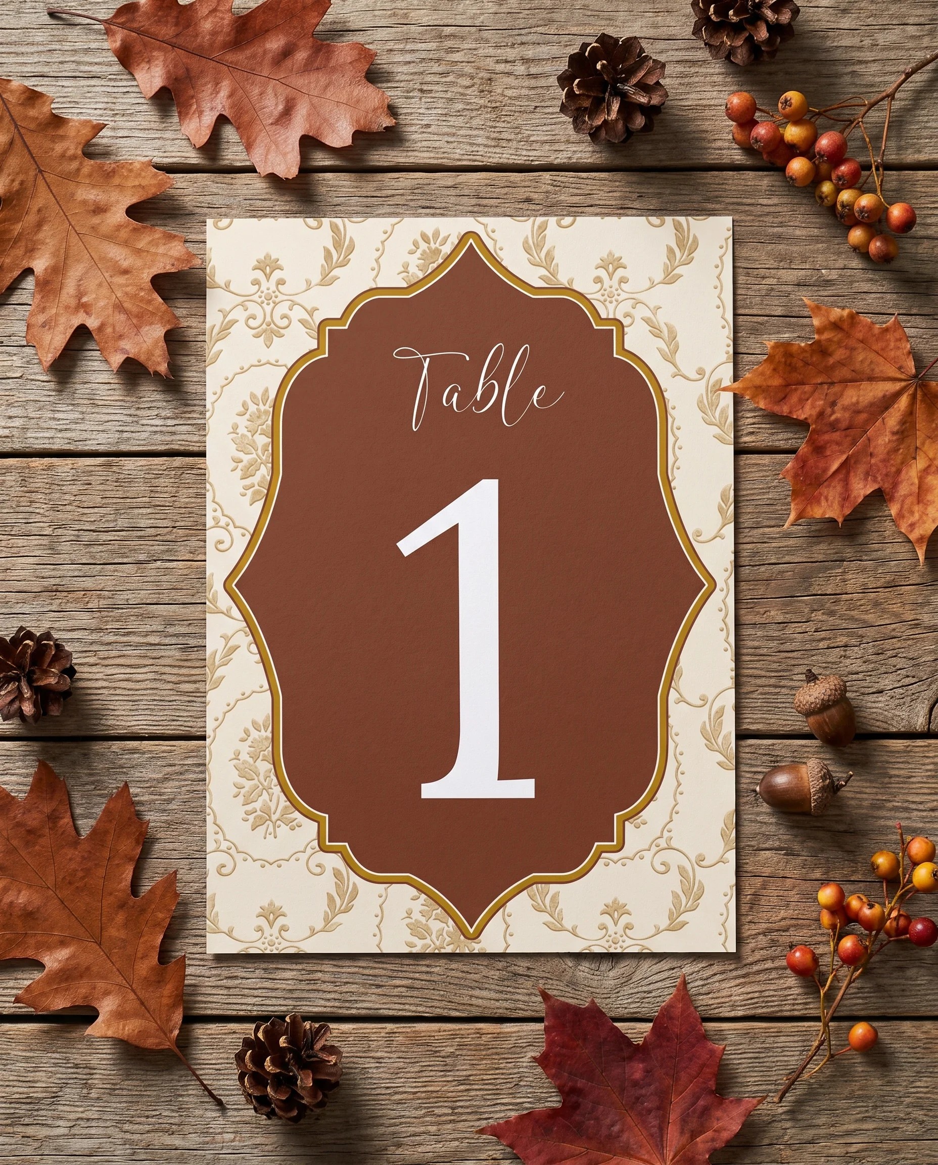 Timberline Reverie wedding table number — single page lying flat under soft overhead light on premium paper, wedding table numbers