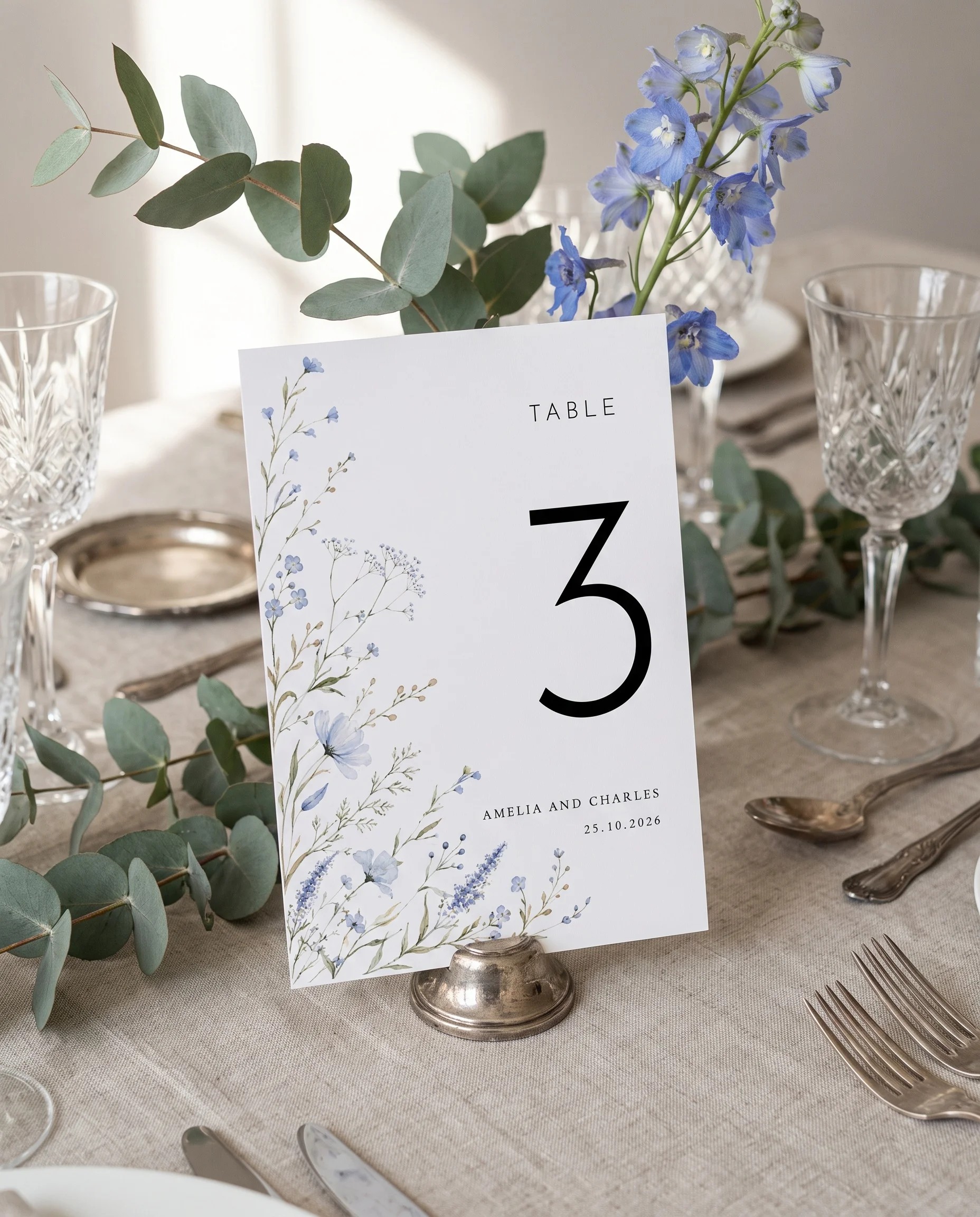 Azure Sprig wedding table number — standing upright on a dressed table under soft overhead light, table numbers wedding